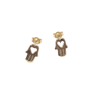 A pair of gold hamsa hand stud earrings with a heart-shaped cutout, displayed on a clean white background.